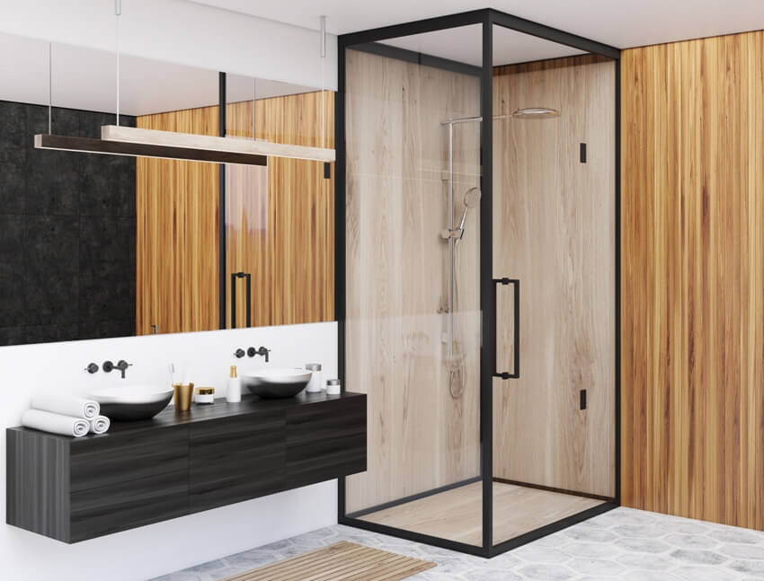 Деревянный уголок ванной комнаты с серыми полами, душевая кабина со стенами из ламината, двойная раковина и большое зеркало