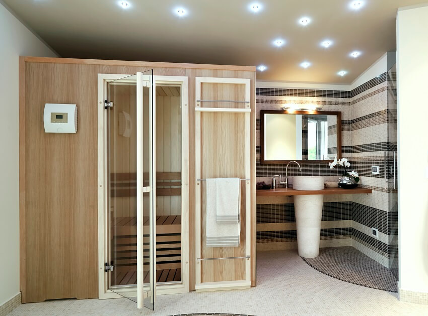 Современная ванная комната с сауной и умывальником 