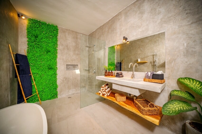 Роскошная современная ванная комната с полированными бетонными стенами и зелено-коричневыми акцентами