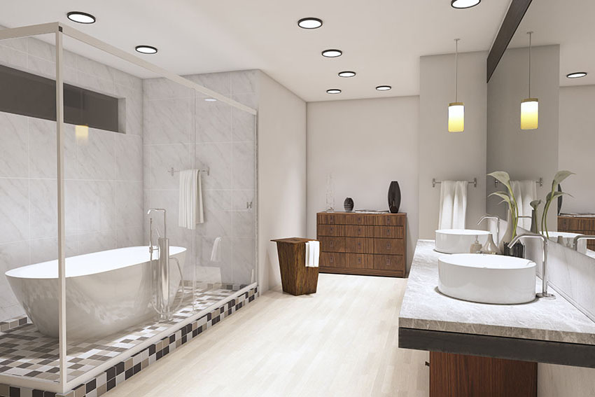 Ванная комната с обрамленной стеклянной дверью душа, деревянным шкафом, встроенными светильниками, бежевой плиткой и светло-серым
