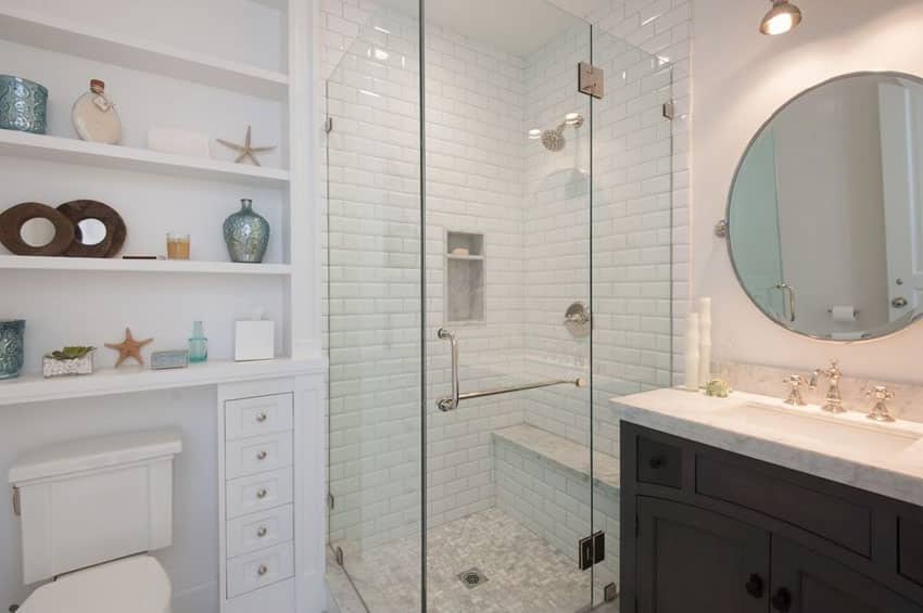 Small bathroom with white paint color, circular mirror and white subway tile