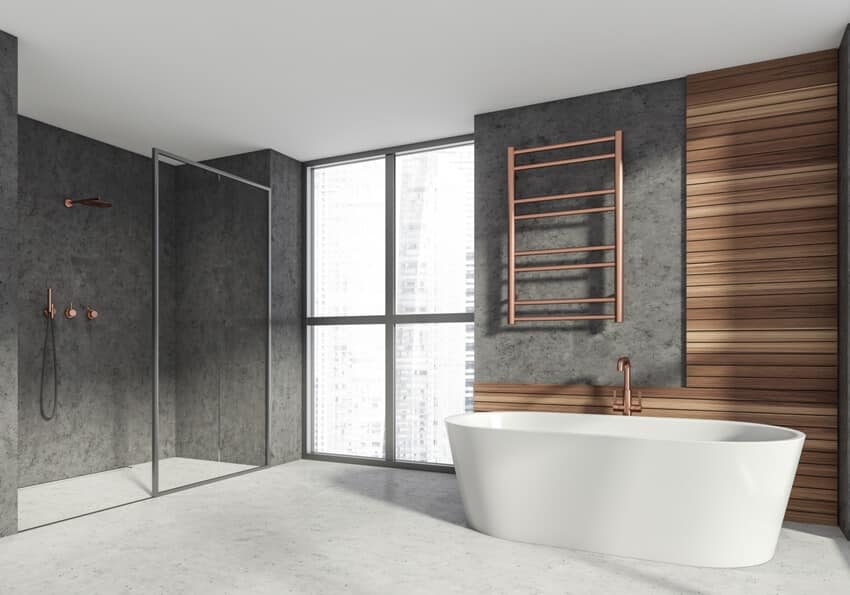 Modern stylish bathroom interior with ceramic bathtub shower cabin
