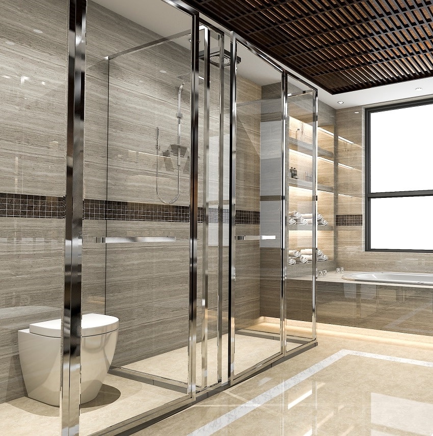 Современная ванная комната в лофте с роскошным декором из плитки и стеклянными душевыми дверями